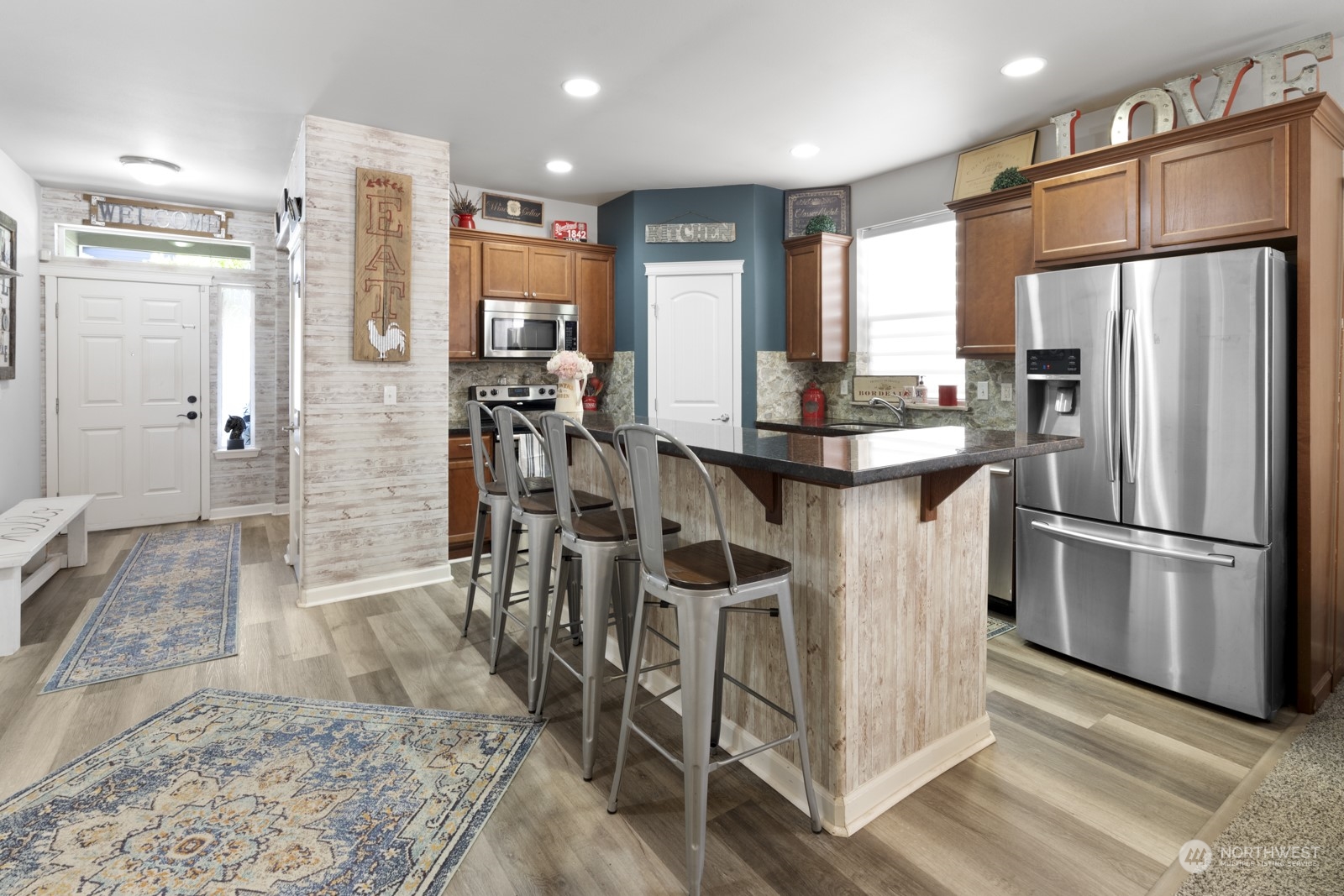 1330 Farina Loop Southeast Olympia, WA 98513 - Photo 4 of 35 a kitchen with stainless steel appliances a refrigerator stove microwave and cabinets