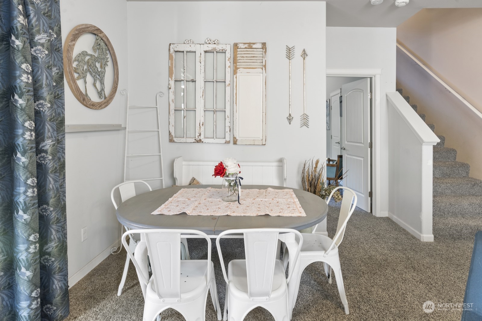 1330 Farina Loop Southeast Olympia, WA 98513 - Photo 9 of 35 a view of a dining room with furniture and a chandelier