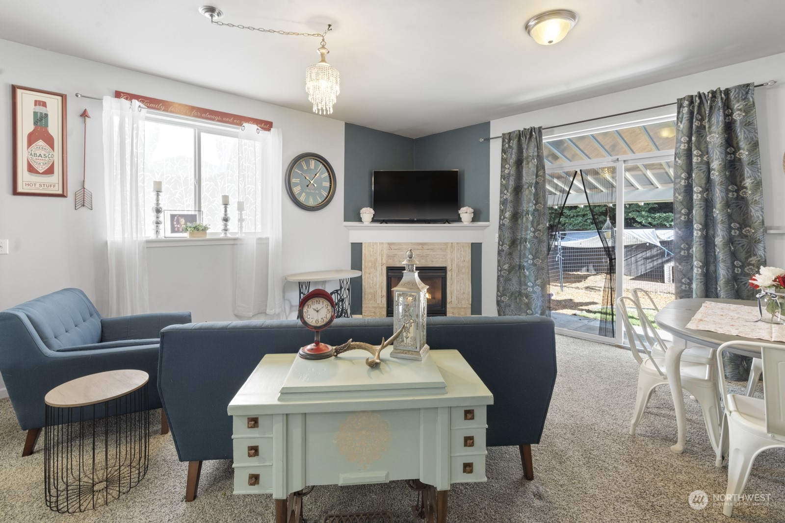1330 Farina Loop Southeast Olympia, WA 98513 - Photo 10 of 35 a living room with furniture a fireplace and a flat screen tv