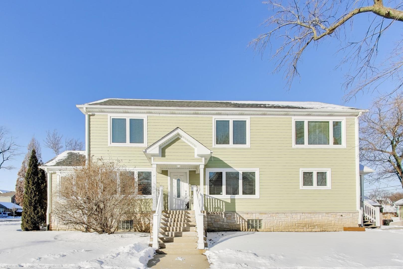 229 North Myrtle Avenue Elmhurst, IL 60126 - Photo 1 of 43 a front view of a house with a yard