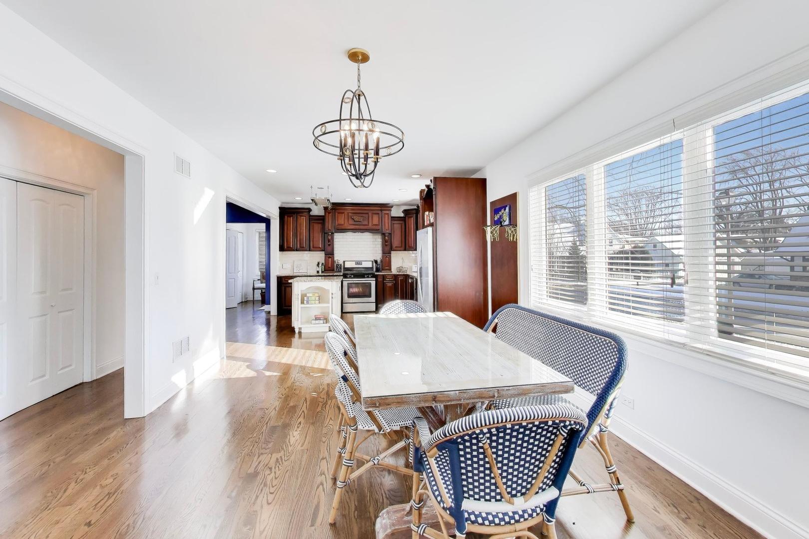 229 North Myrtle Avenue Elmhurst, IL 60126 - Photo 11 of 43 a view of a dining room with furniture window and wooden floor