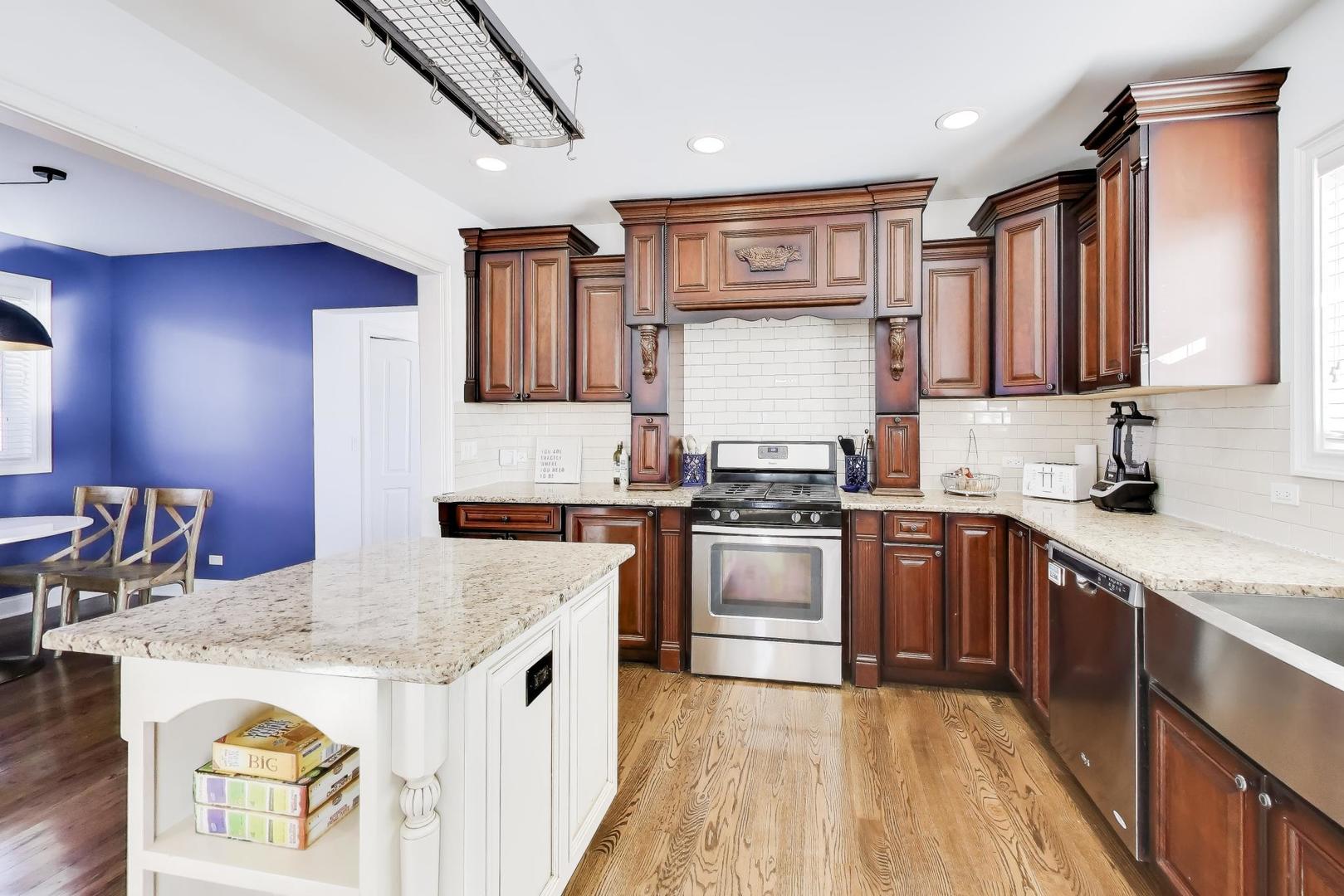 229 North Myrtle Avenue Elmhurst, IL 60126 - Photo 13 of 43 a kitchen with stainless steel appliances granite countertop a stove sink and cabinets