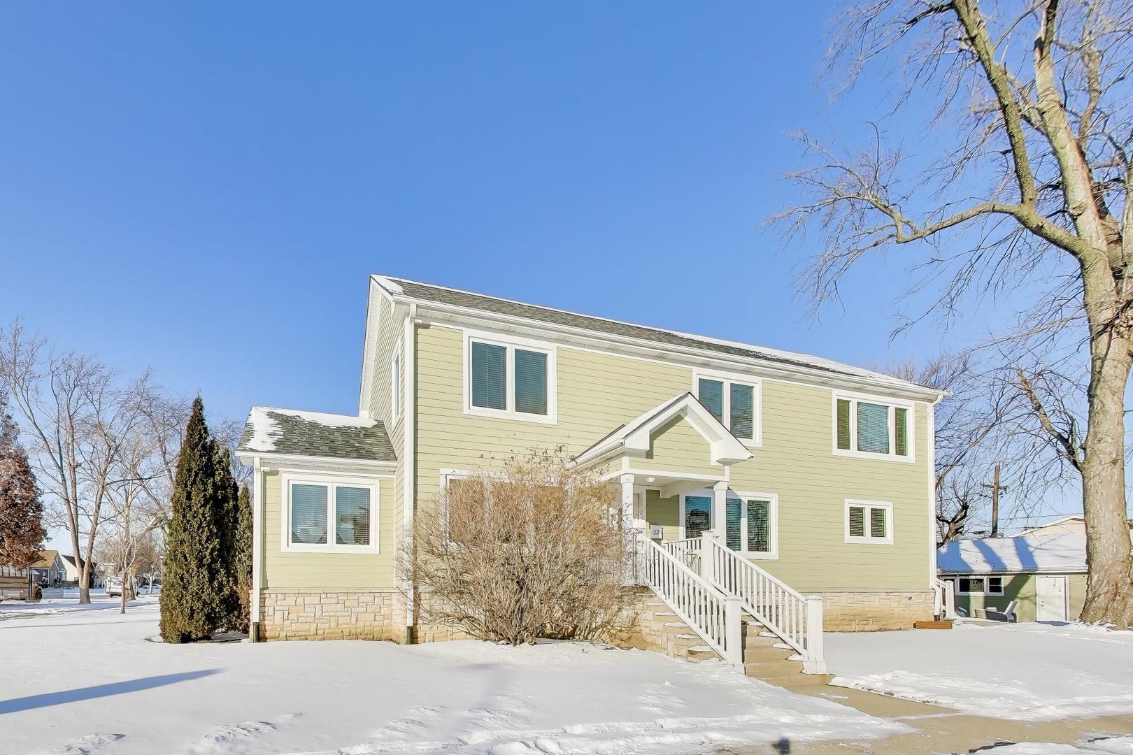 229 North Myrtle Avenue Elmhurst, IL 60126 - Photo 3 of 43 a front view of a house with a yard
