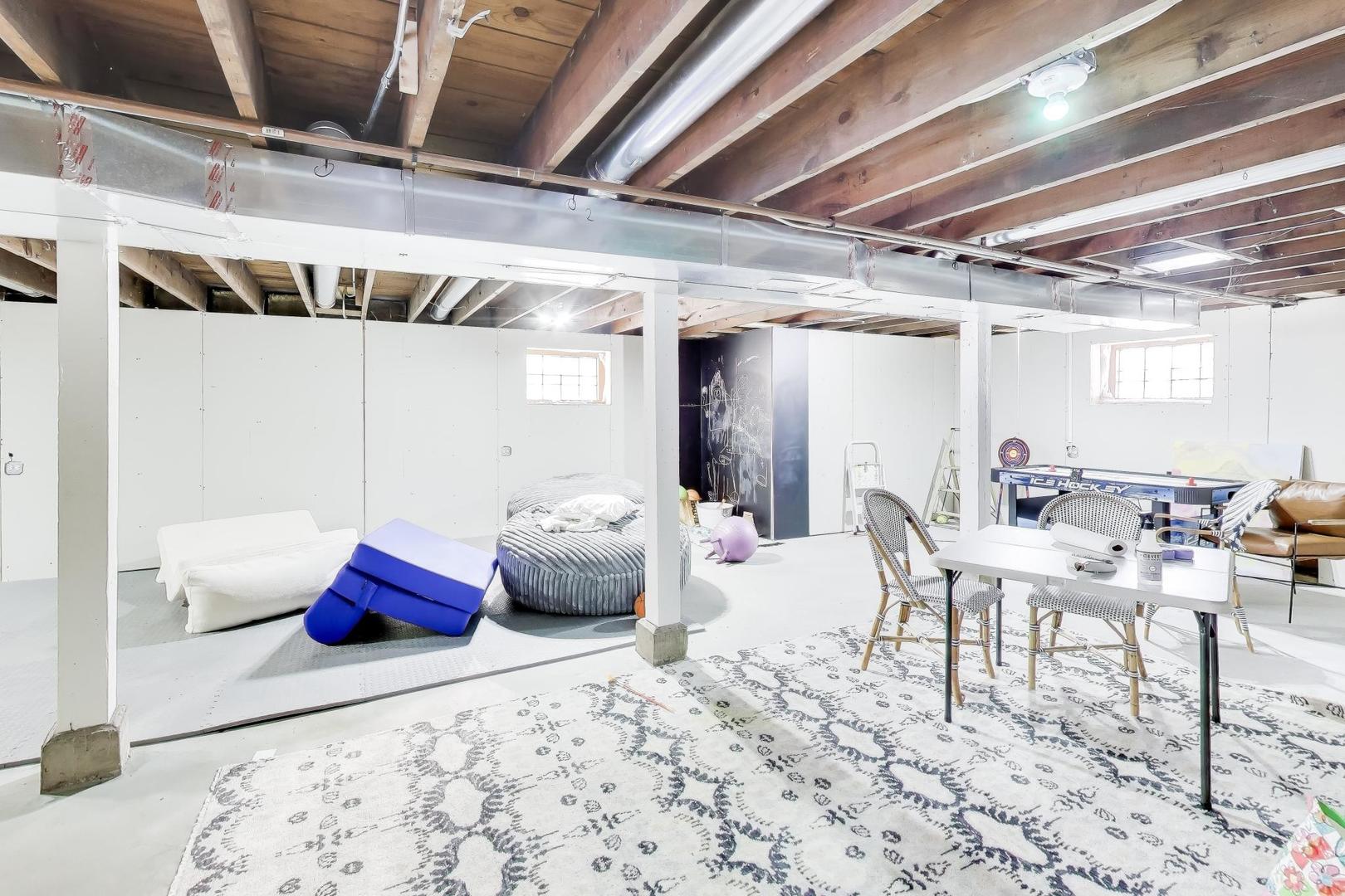 229 North Myrtle Avenue Elmhurst, IL 60126 - Photo 34 of 43 a bedroom with furniture and a chandelier