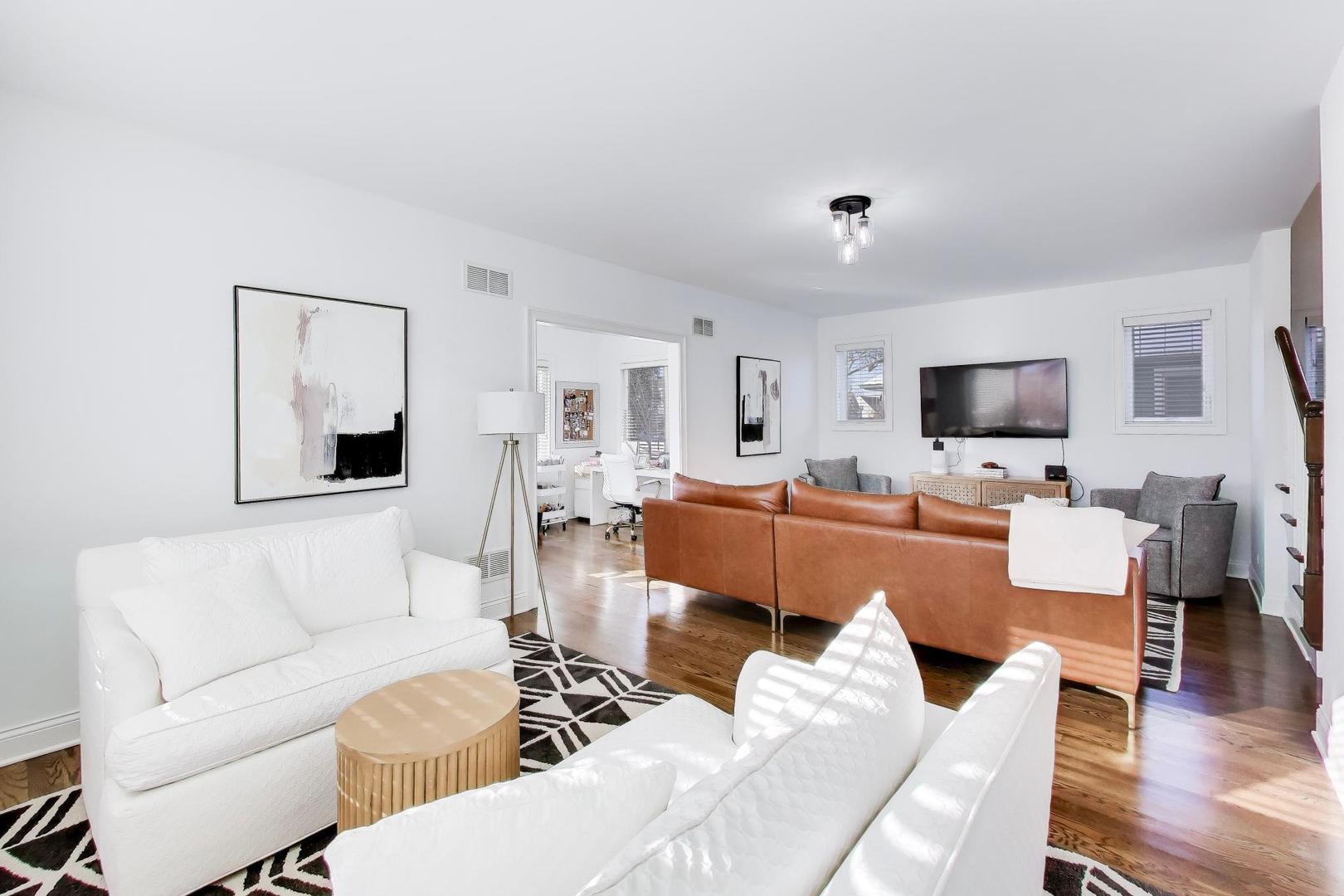 229 North Myrtle Avenue Elmhurst, IL 60126 - Photo 4 of 43 a living room with furniture flat screen tv and couches