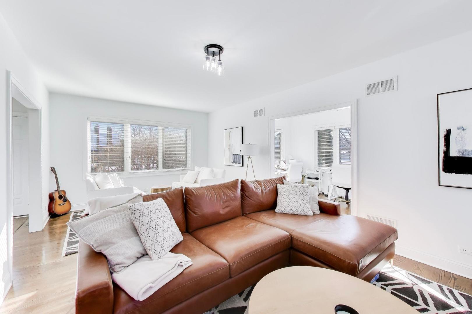 229 North Myrtle Avenue Elmhurst, IL 60126 - Photo 6 of 43 a living room with furniture and a large window