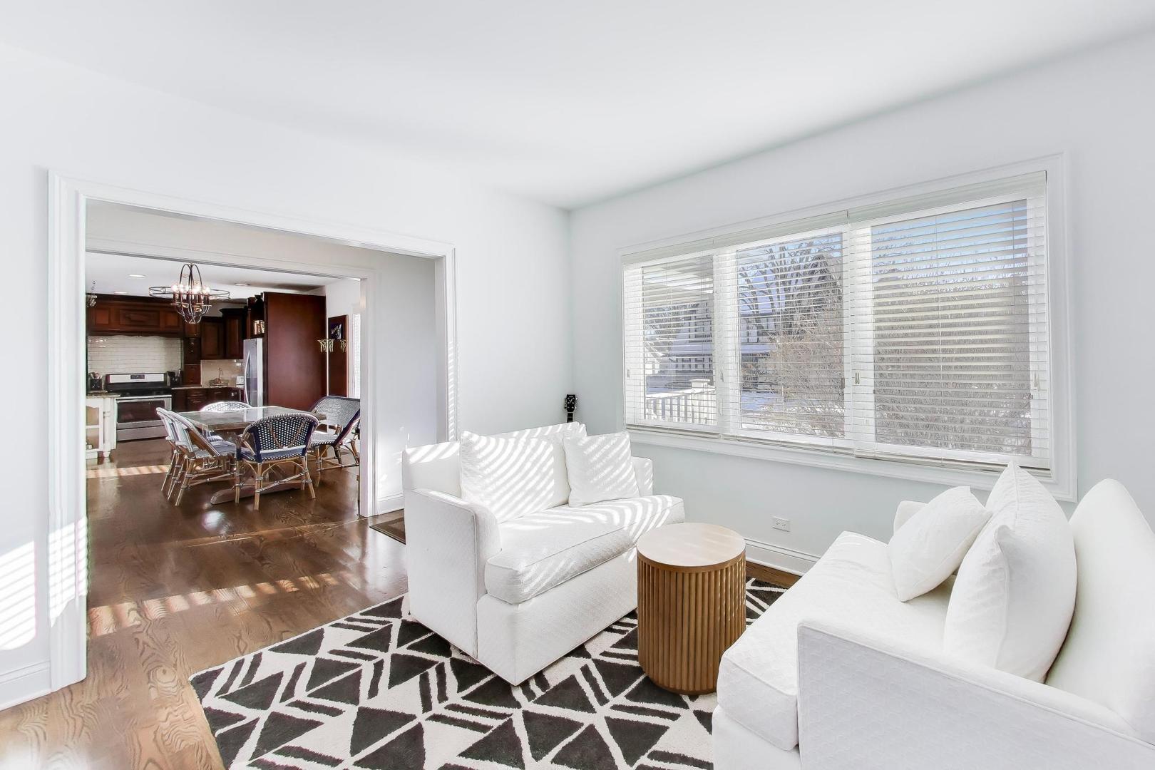 229 North Myrtle Avenue Elmhurst, IL 60126 - Photo 7 of 43 a living room with furniture and a large window