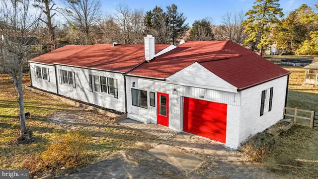 a living room with furniture a fireplace and window