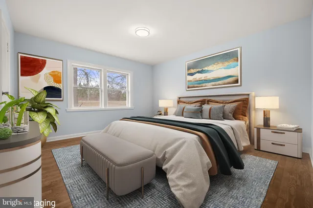 a bedroom with bed and a couch