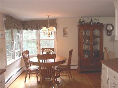 Undisclosed Address Centerville, MA 02632 - Photo 5 of 5 a view of a dining room with furniture window and wooden floor