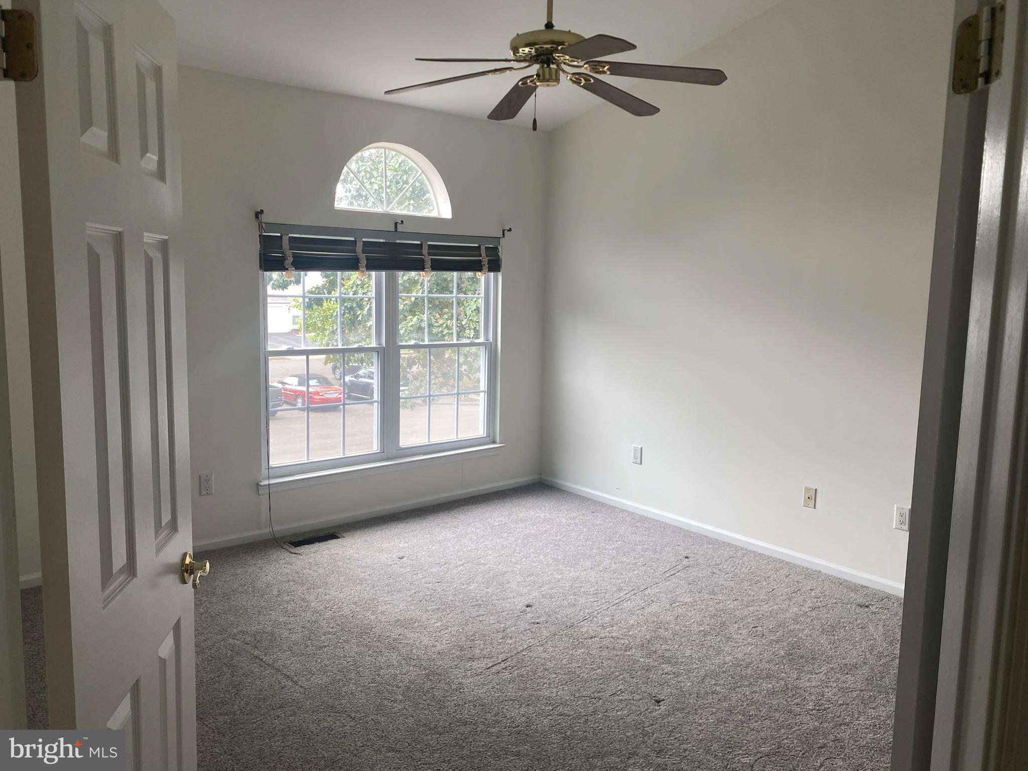 113 North Park Road Newtown, PA 18940 - Photo 20 of 27 an empty room with a window and a chandelier