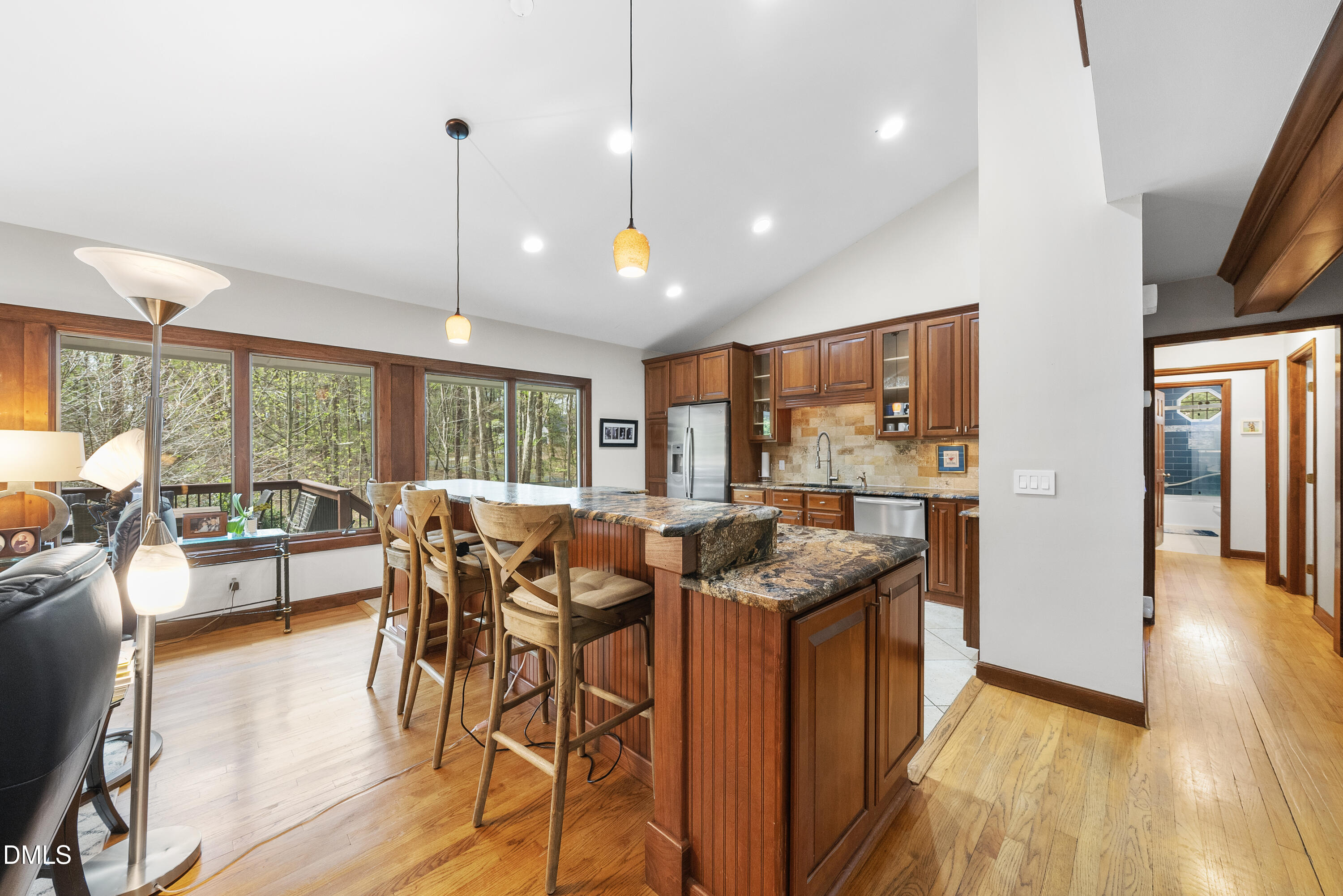 6200 Splitrock Trail Apex, NC 27539 - Photo 13 of 64 a view of a dining hall with furniture and wooden floor