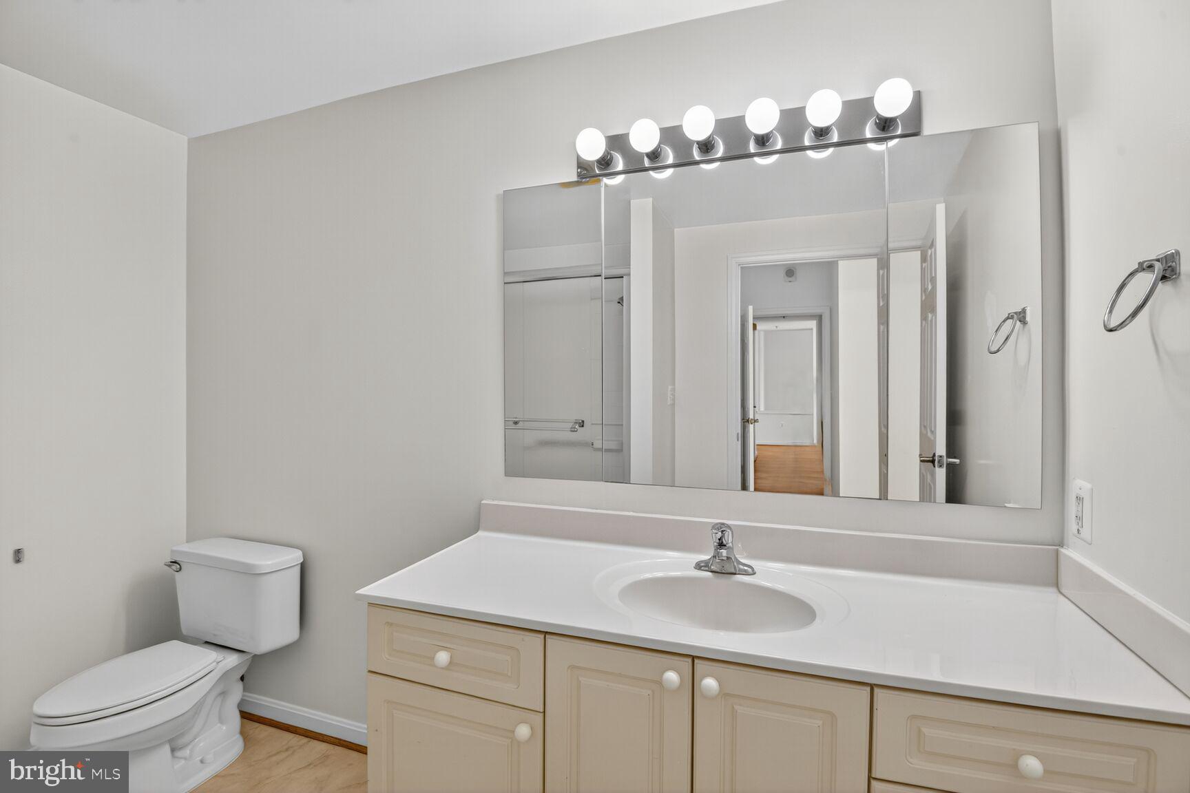 3200 North Leisure World Boulevard, Unit 918 Silver Spring, MD 20906 - Photo 12 of 22 a bathroom with a sink and a toilet