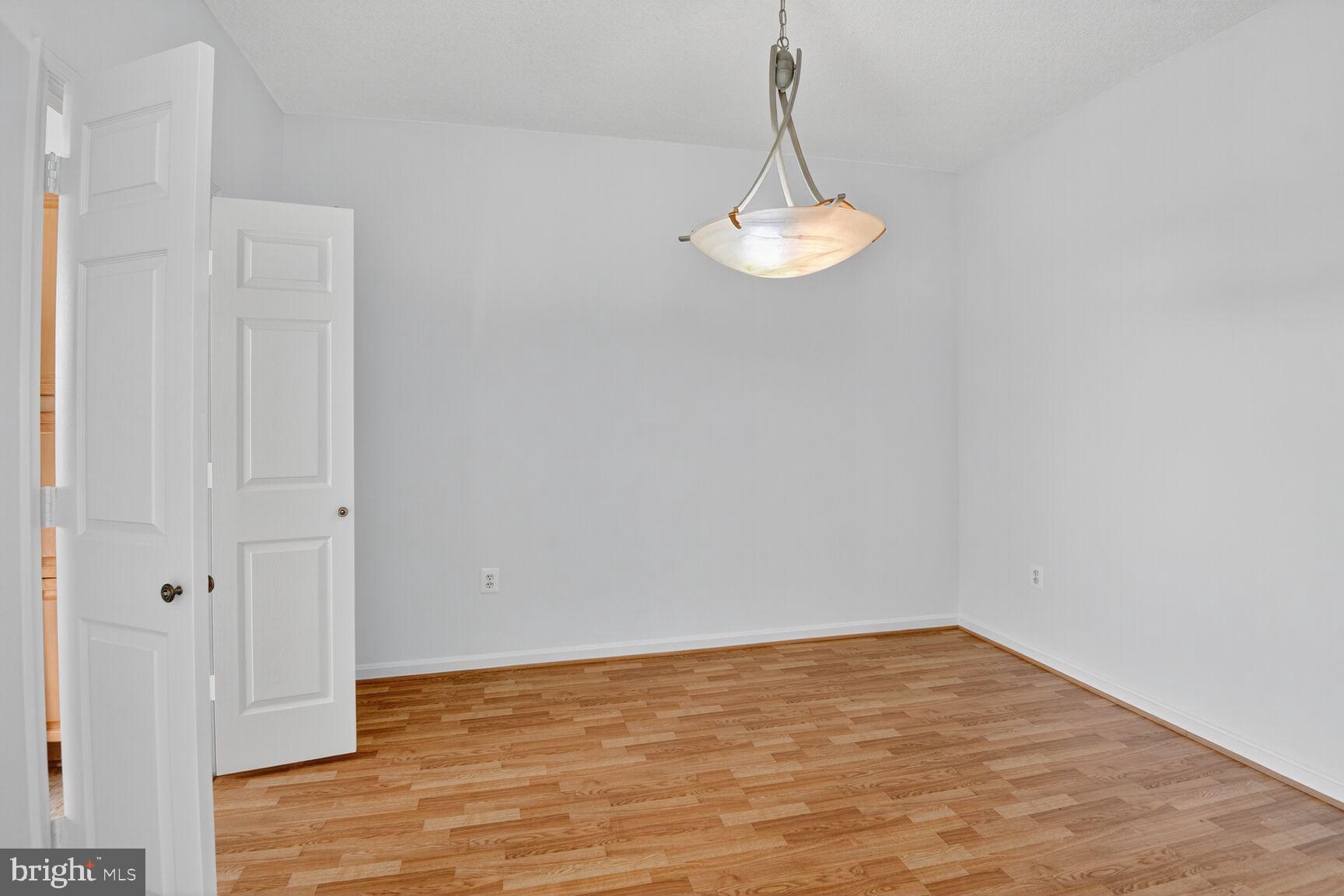 3200 North Leisure World Boulevard, Unit 918 Silver Spring, MD 20906 - Photo 9 of 22 a view of empty room with wooden floor