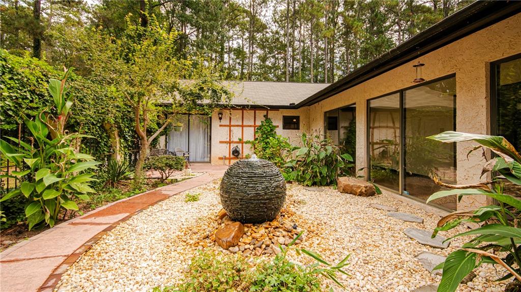 2301 Brooks Road Southeast Dacula, GA 30019 - Photo 20 of 63 a view of a backyard with potted plants