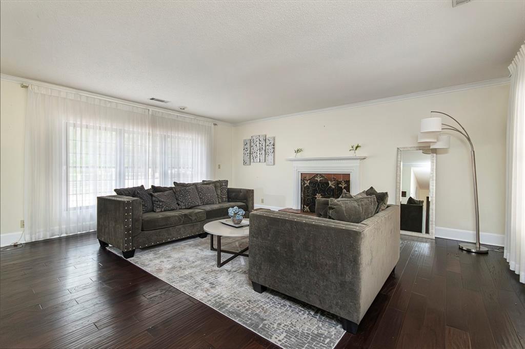 2301 Brooks Road Southeast Dacula, GA 30019 - Photo 24 of 63 a living room with furniture and a fireplace