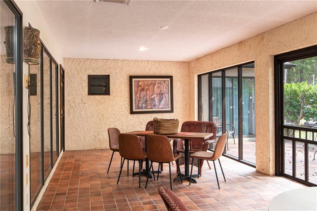2301 Brooks Road Southeast Dacula, GA 30019 - Photo 35 of 63 a view of a dining room with furniture window and wooden floor