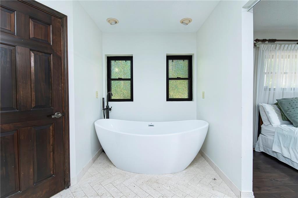 2301 Brooks Road Southeast Dacula, GA 30019 - Photo 41 of 63 a view of a bathtub in a room