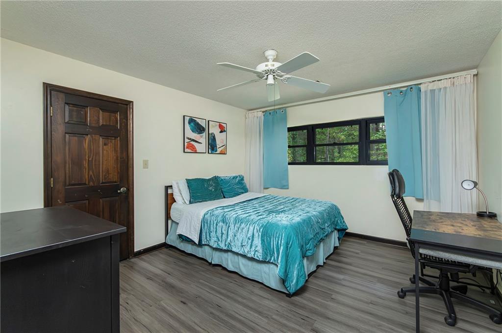 2301 Brooks Road Southeast Dacula, GA 30019 - Photo 44 of 63 a bedroom with a bed and a table