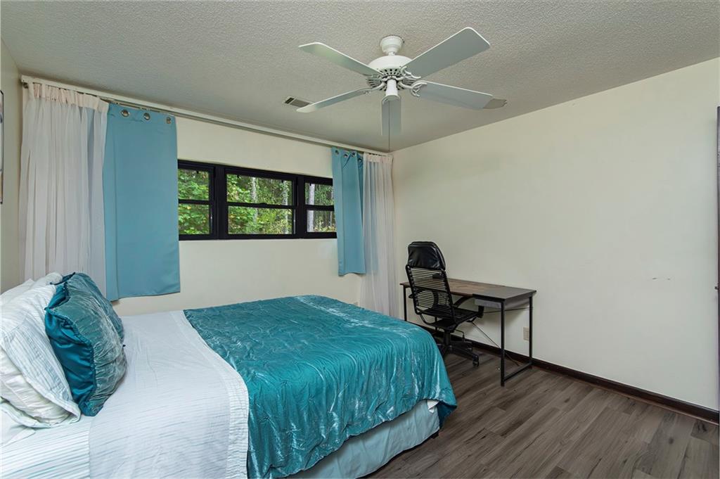 2301 Brooks Road Southeast Dacula, GA 30019 - Photo 45 of 63 a bedroom with a bed and a window