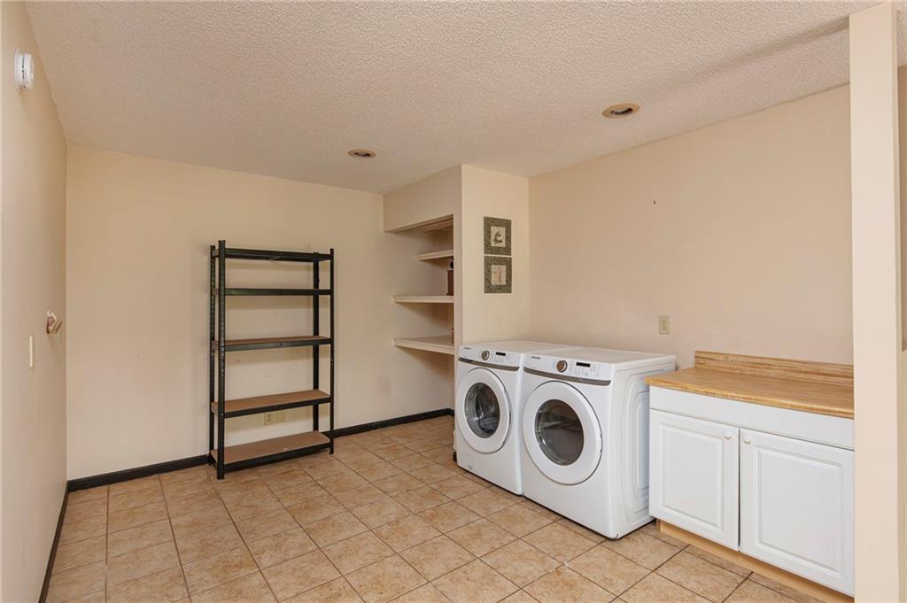 2301 Brooks Road Southeast Dacula, GA 30019 - Photo 47 of 63 a utility room with dryer and washer