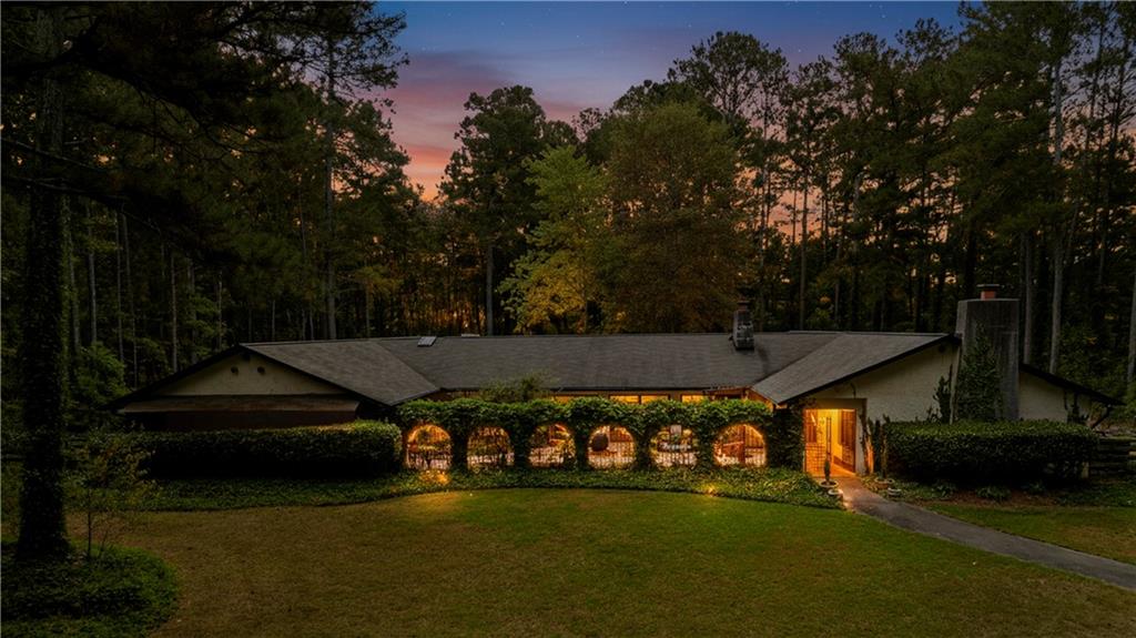 2301 Brooks Road Southeast Dacula, GA 30019 - Photo 5 of 63 a view of a couches in the patio next to a yard