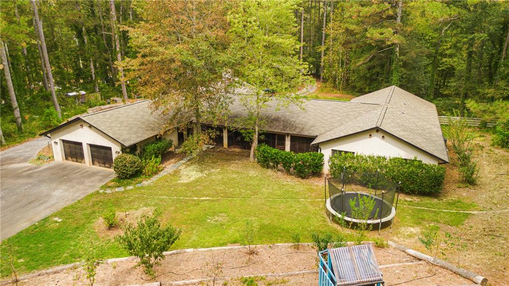 2301 Brooks Road Southeast Dacula, GA 30019 - Photo 6 of 63 front view of a house with a yard