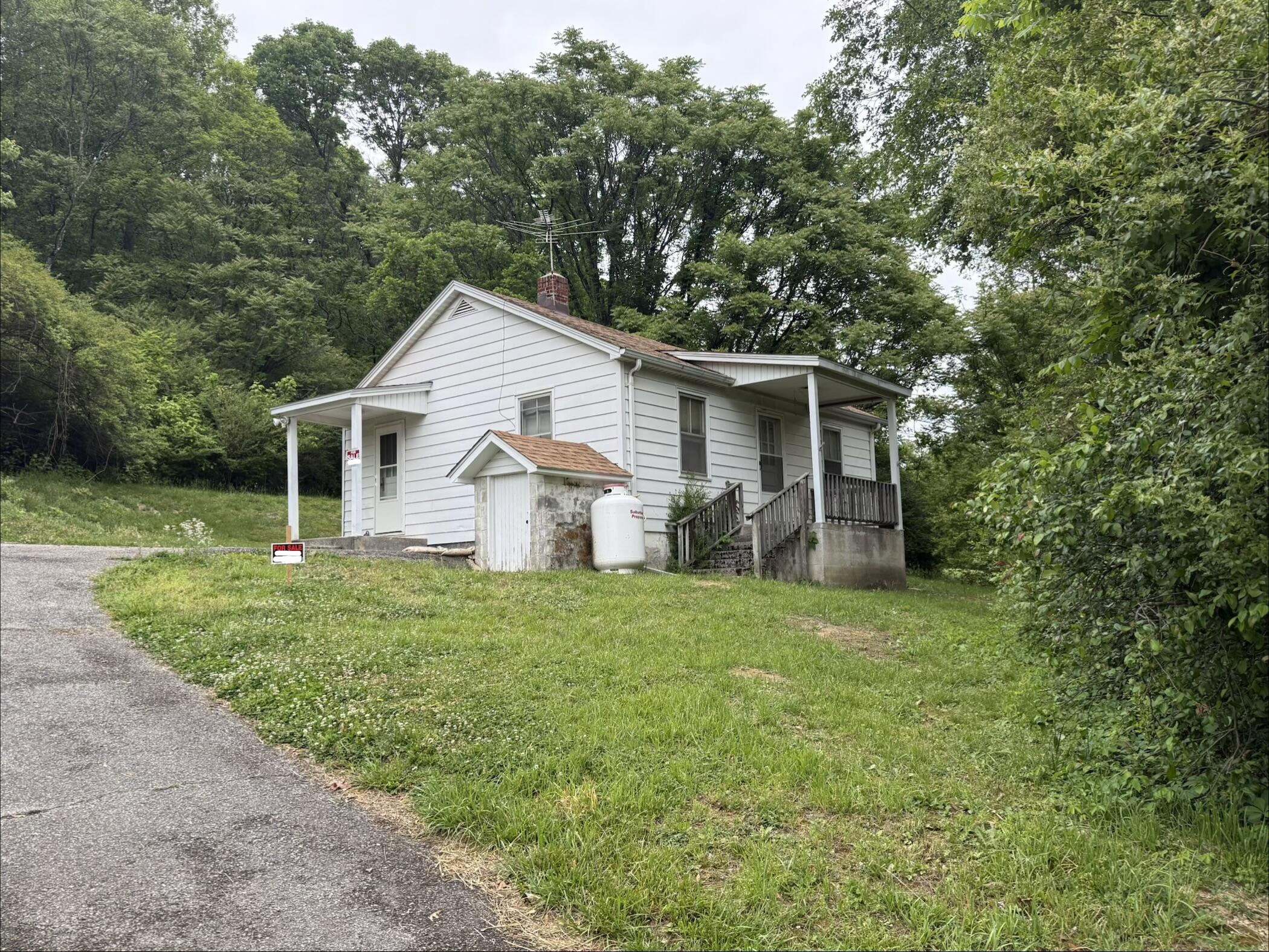 111 Spring Hollow Road Troutville, VA 24175 - Photo 1 of 7 a view of a house with backyard and garden