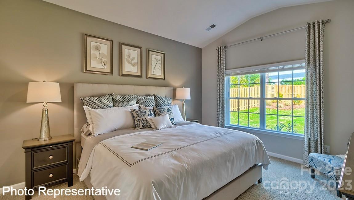 48 Burdock Road Fletcher, NC 28732 - Photo 23 of 30 a bedroom with a bed and a window