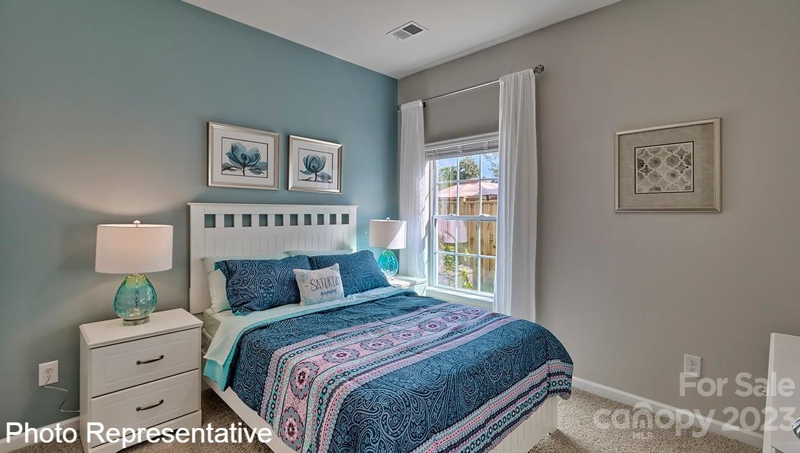 48 Burdock Road Fletcher, NC 28732 - Photo 7 of 30 a bedroom with a bed and a night stand