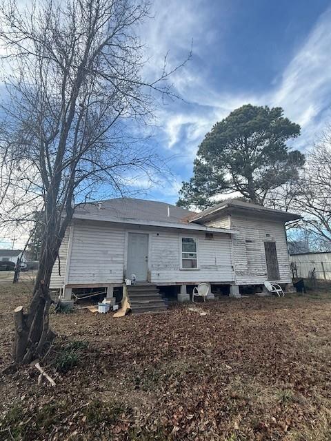 579 17th Street Southeast Paris, TX 75460 - Photo 22 of 22 a view of a house with a backyard and trees