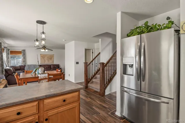 a view of a kitchen with cabinets and stainless steel appliances