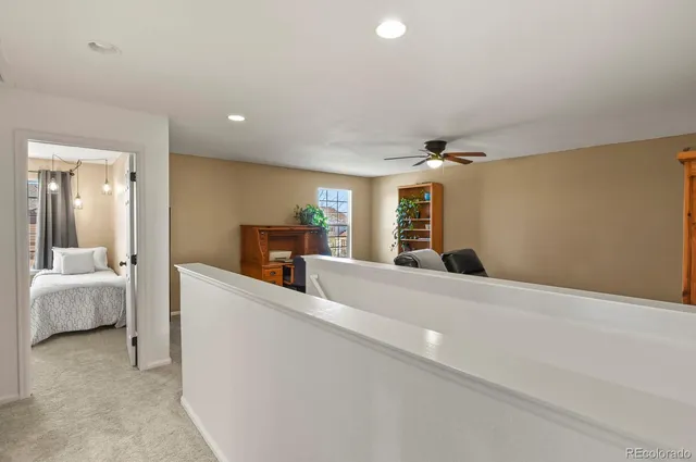 a view of an empty room and a bedroom