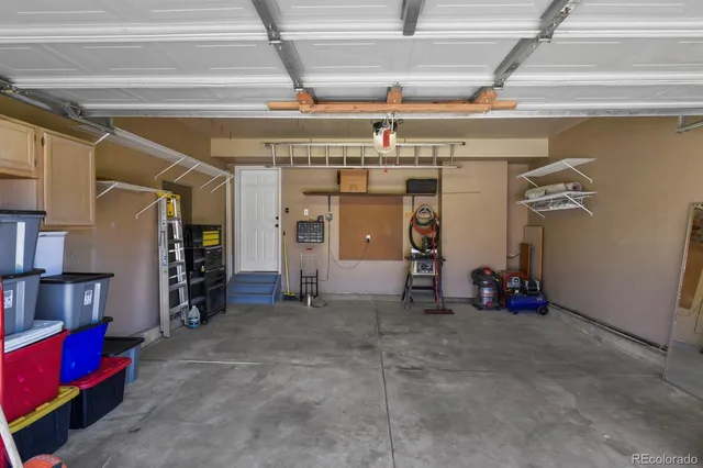 a view of a roof deck with table and chairs