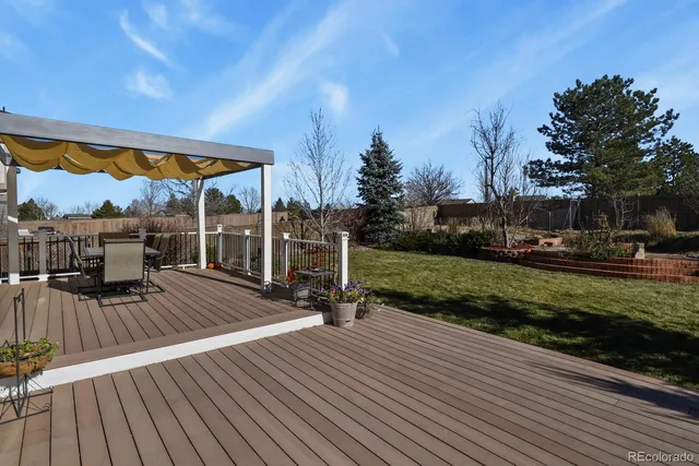 a wooden bench sitting in front of a house