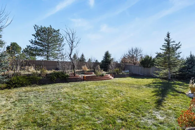 a view of a fountain in front of a house