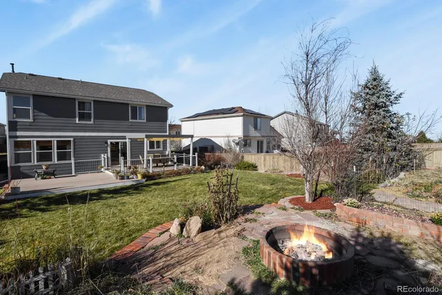 a view of a house with a garden and plants