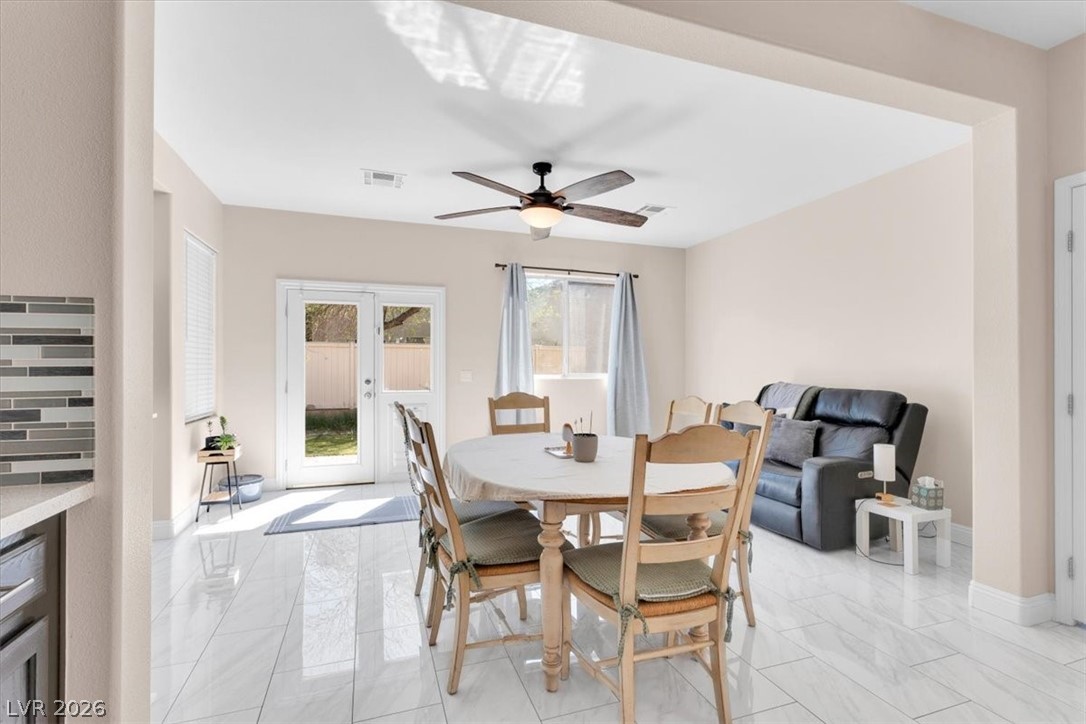 1019 Garnet Ridge Court Las Vegas, NV 89123 - Photo 11 of 34 Dining space with ceiling fan and french doors