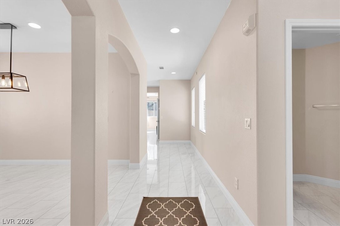1019 Garnet Ridge Court Las Vegas, NV 89123 - Photo 12 of 34 Hall with arched walkways and recessed lighting