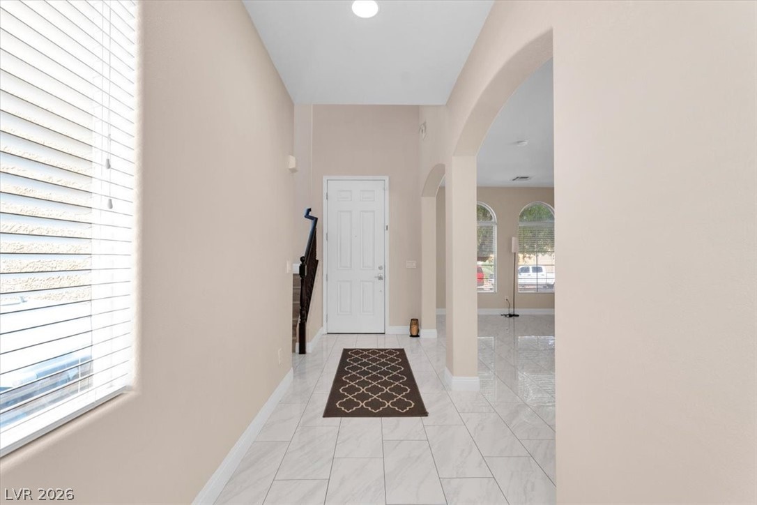 1019 Garnet Ridge Court Las Vegas, NV 89123 - Photo 13 of 34 Foyer entrance featuring arched walkways and light marble finish floors