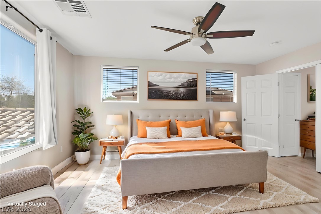 1019 Garnet Ridge Court Las Vegas, NV 89123 - Photo 14 of 34 Bedroom featuring light wood-style flooring and ceiling fan