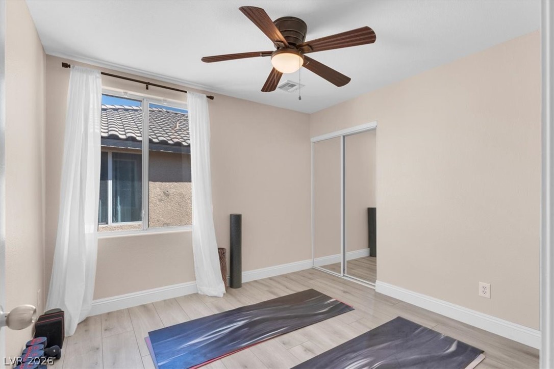 1019 Garnet Ridge Court Las Vegas, NV 89123 - Photo 22 of 34 Workout room featuring light wood-style flooring and a ceiling fan