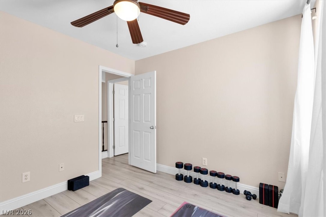 1019 Garnet Ridge Court Las Vegas, NV 89123 - Photo 23 of 34 Exercise room with light wood-style flooring and a ceiling fan