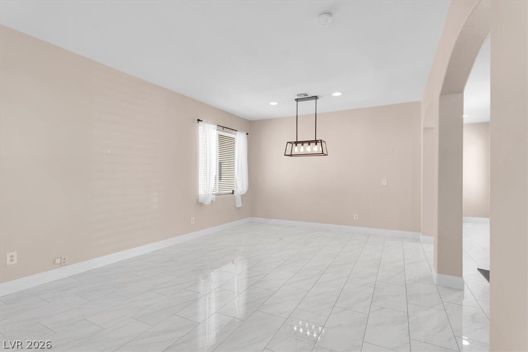 1019 Garnet Ridge Court Las Vegas, NV 89123 - Photo 30 of 34 Spare room featuring arched walkways and recessed lighting