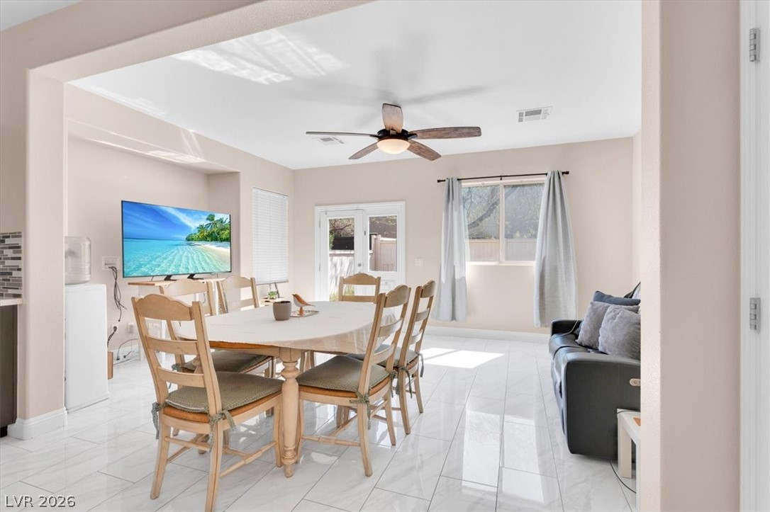 1019 Garnet Ridge Court Las Vegas, NV 89123 - Photo 10 of 34 Dining area with a ceiling fan and french doors