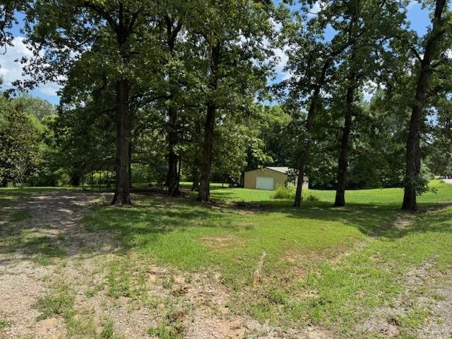 165 Pittman Road Somerville, TN 38068 - Photo 11 of 17 View of grassy yard featuring an outdoor structure