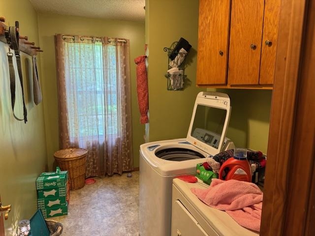 165 Pittman Road Somerville, TN 38068 - Photo 9 of 17 Laundry area featuring washer and clothes dryer, cabinet space, and light floors