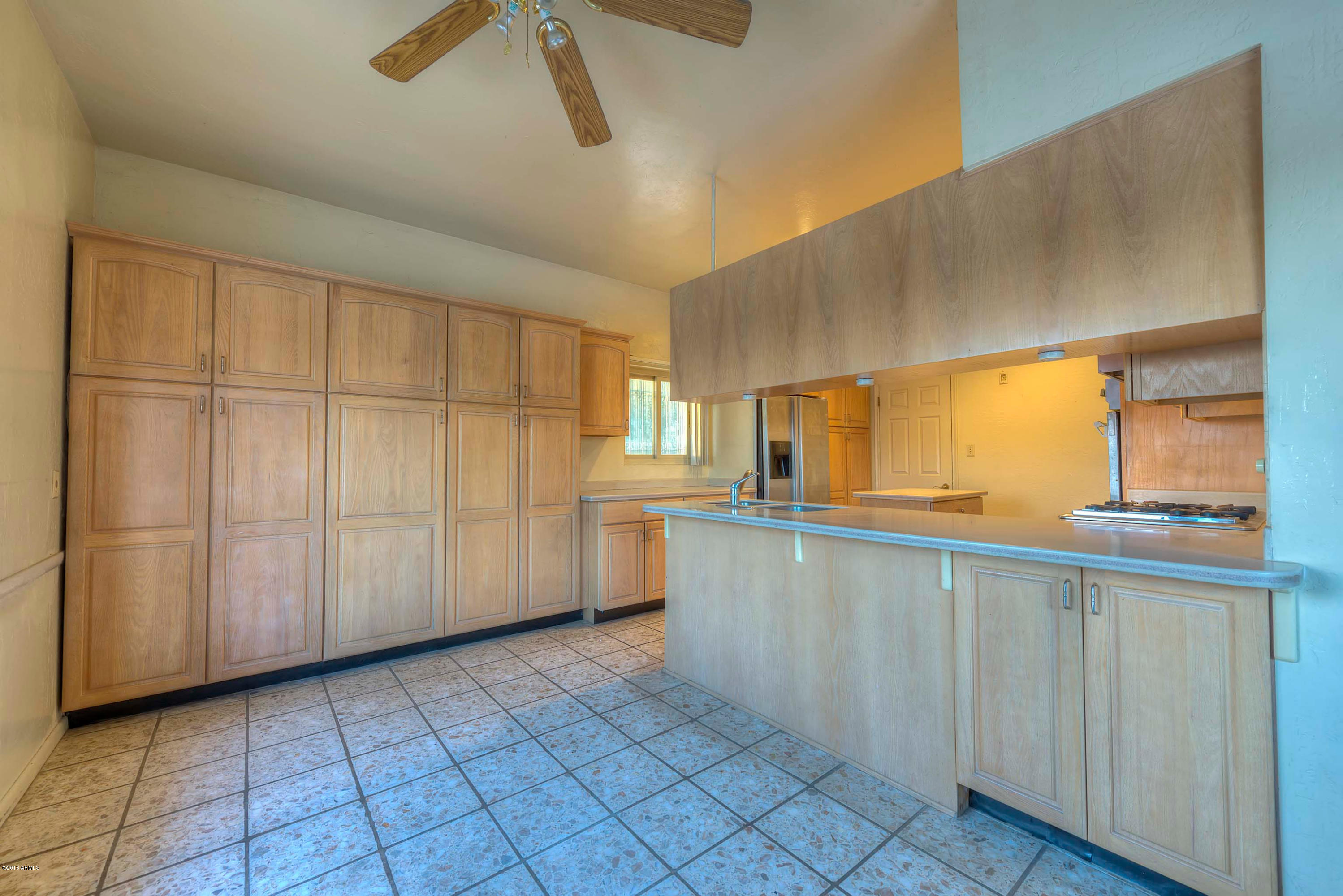 5353 East Rockridge Road Phoenix, AZ 85018 - Photo 13 of 24 011_Breakfast Room and Cabinet Stora
