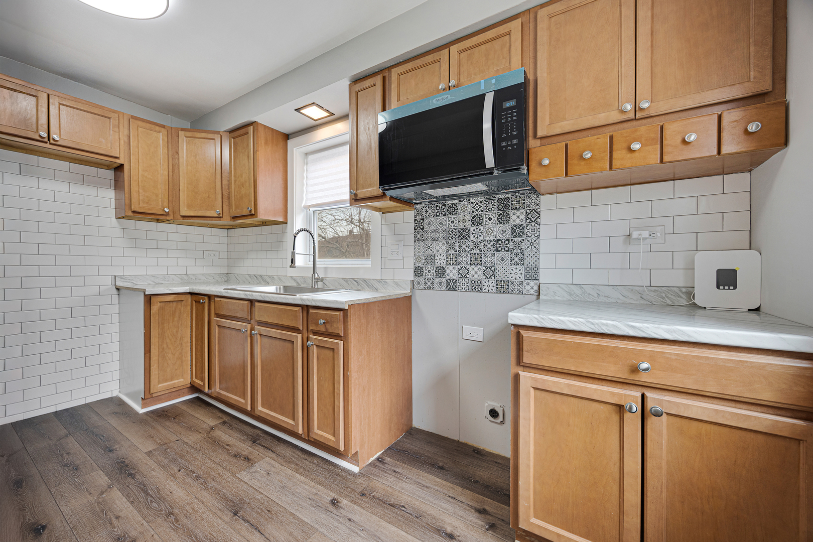 101 West 113th Place Chicago, IL 60628 - Photo 11 of 15 a kitchen with stainless steel appliances granite countertop a sink and a microwave