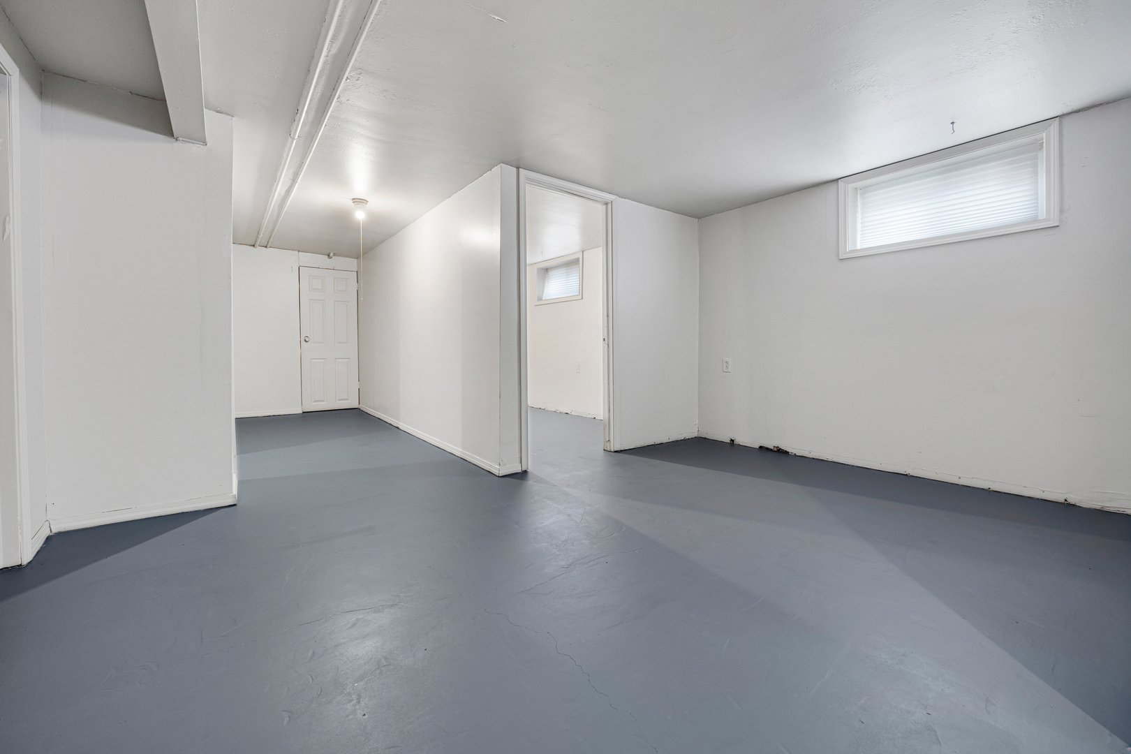 101 West 113th Place Chicago, IL 60628 - Photo 12 of 15 an empty room with wooden floor and windows